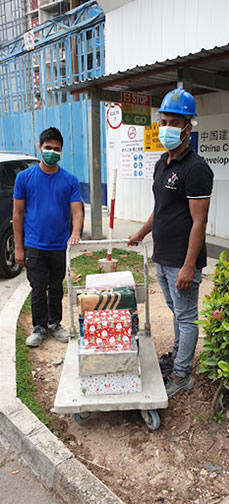 Christmas packages to migrant friends in Sims Rd